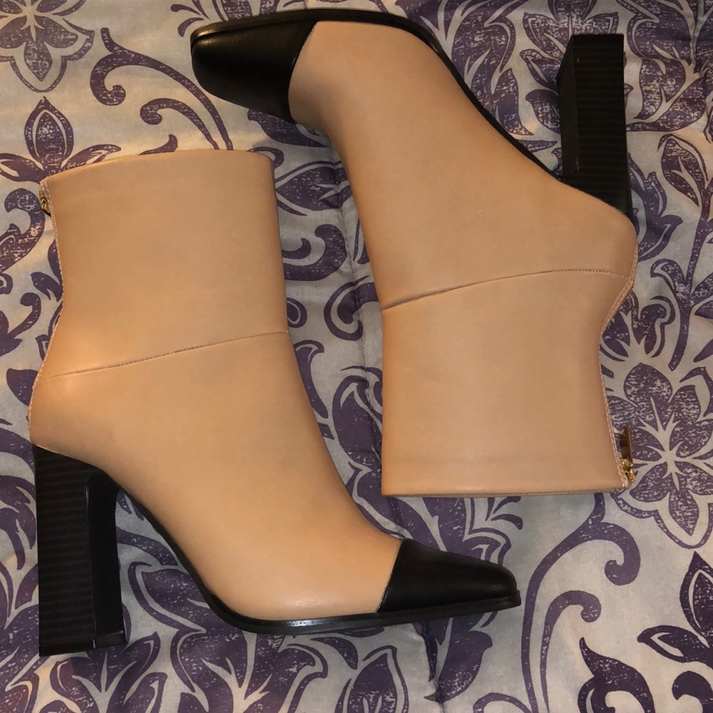 Beige tan heeled booties with black design
